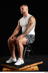 Whole Body Man White Sports Shorts Muscular Sitting Top Studio photo references